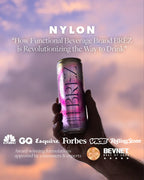 Hand holding a can of BREZ functional beverage with a purple and pink design against a blurred sky background.